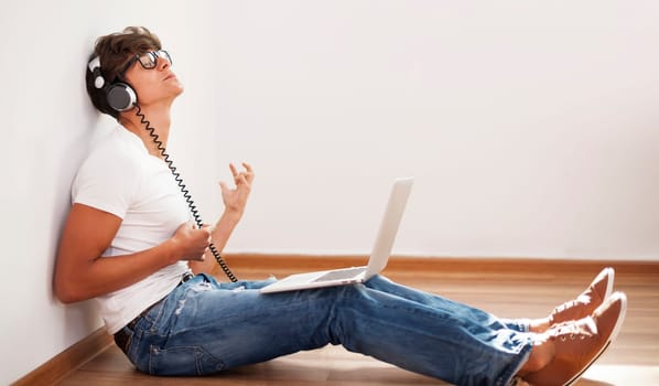 Hipster man playing air guitar