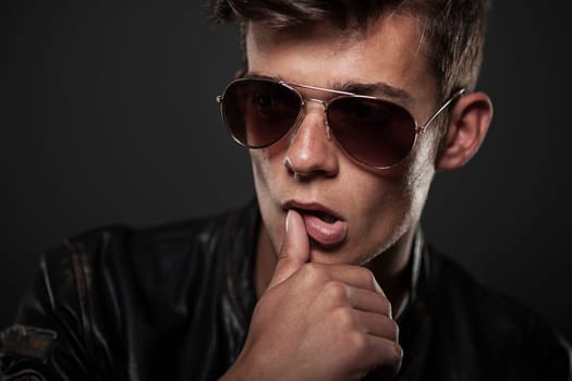Portrait of sexy man wearing sunglasses