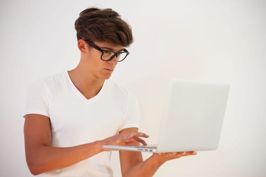 Handsome young man using computer