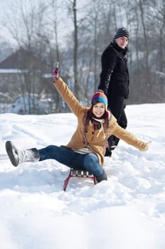 Young couple together in the snow