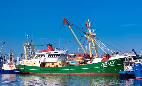 dutch fishing boats in the Urk harbor. Urk has by far the largest fishing fleet and fish processing industry in the Netherlands.