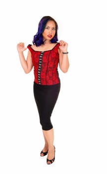A pretty Asian woman in a red corset and black skirt standing isolated .for white background, looking serious..