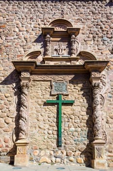 Green cross on the side of San Francisco church in Potosi, Bolivia