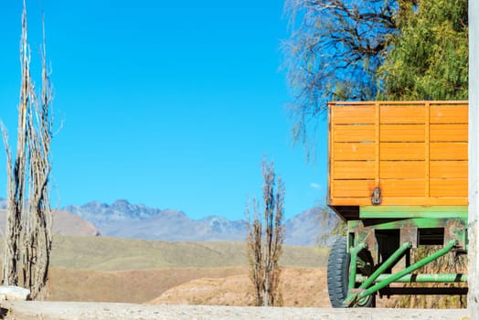 A green and orange cart on a farm near Potosi, Bolivia
