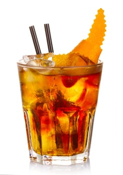 Manhatten alcohol cocktail with orange fruit rind isolated on white background