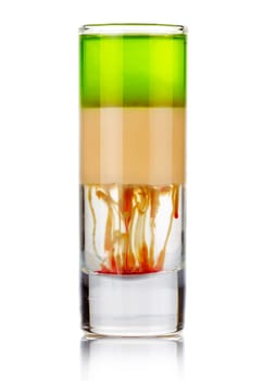Shot sliced alcohol cocktail with drops isolated on white background