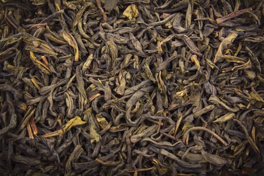 Heap of dry green tea (texture). Macro shot.