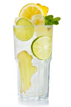 Full glass of fresh birch juice with lemon, ginger and mint leaves isolated