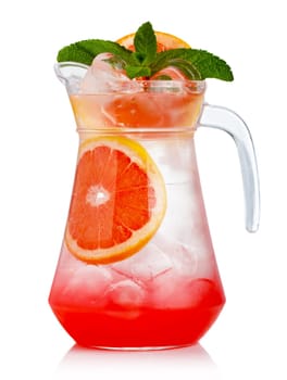 Full jug of fresh nonalcoholic cocktail with grapefruit and green mint isolated