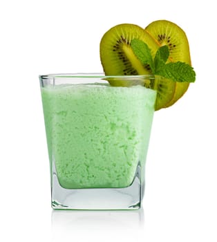 Glass of kiwi smoothie with fruits and fresh green mint leaves isolated