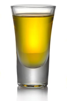 Gold transparent tequila shot isolated on white background