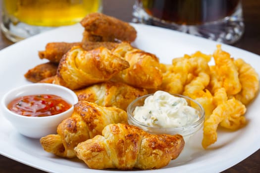 Fresh golden croissants with jams for breakfast
