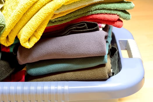 Coloured linen in the laundry basket