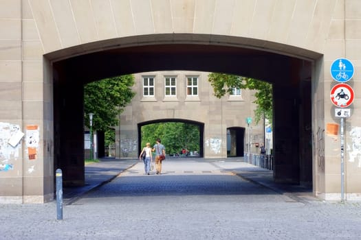 Mainz,Germany – August 09,2014: Two students leave Johannes Gutenberg University through the entrance portal on August 9,2014 in Mainz.