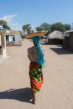 African woman with basket in head