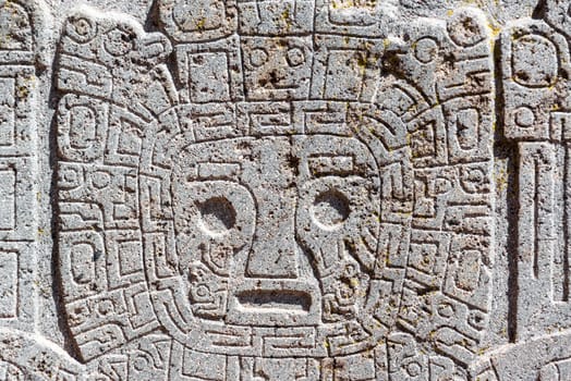 Closeup view of a face carving at the Tiwanaku ruins near La Paz, Bolivia