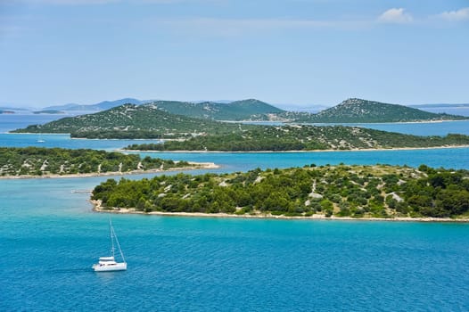 Sailing on sailboat near island in Croatia