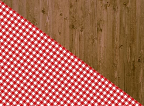 Wooden table with diagonal tablecloth in red and white