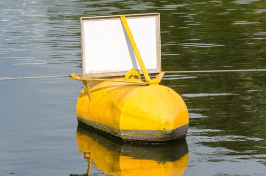 Sea sign buoy ton yellow,black indicates a danger point