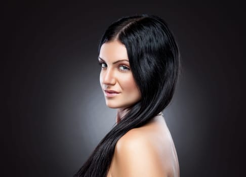 Young beauty with long dark hair and perfect skin