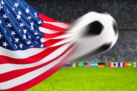 Football flies in front of waving American flag