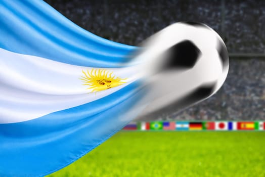 Football flies in front of waving Argentine flag
