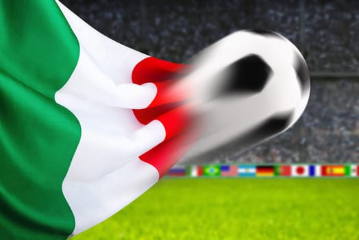 Football flies in front of waving Italian flag
