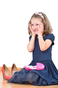Happy cute little girl prepared for a make-up