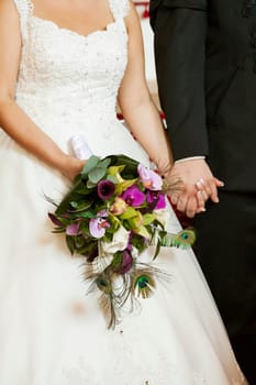 Bride and groom holding hands. Wedding theme