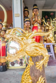 Handicraft golden dragon made of wood, stock photo