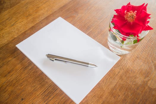 Love letter paper on wooden table, stock photo