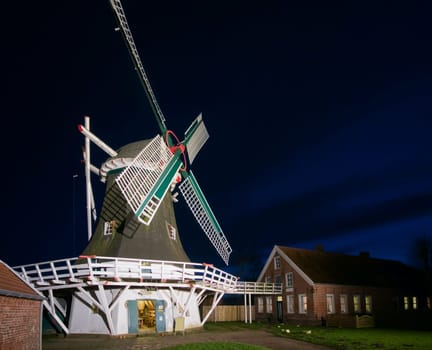 Wide-angle view of the Seriemer Mill in East Frisia (Germany) at night