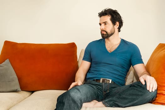 An image of a handsome but depressed man with a beard