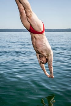 An image of a handsome man at the lake