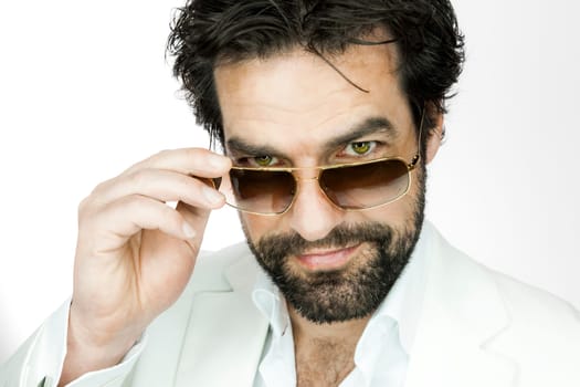 A handsome man with a beard and sun glasses