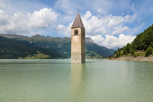 An image of the church tower in the Reschensee Italy
