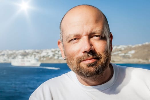 An image of a handsome middle age man with a beard
