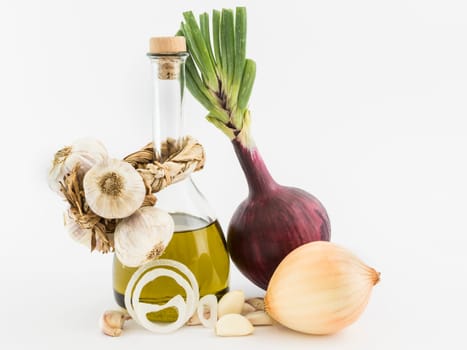 onions, garlic and olive oil on white background
