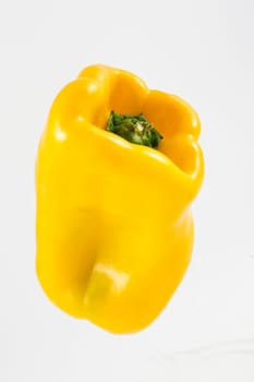 One pepper yellow on white background