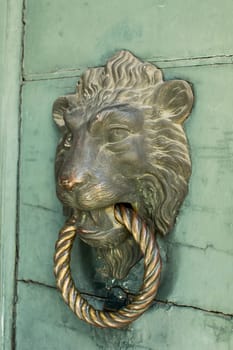 Doors with door knocker in the shape of lion head