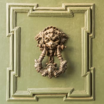 Doors with door knocker in the shape of lion head