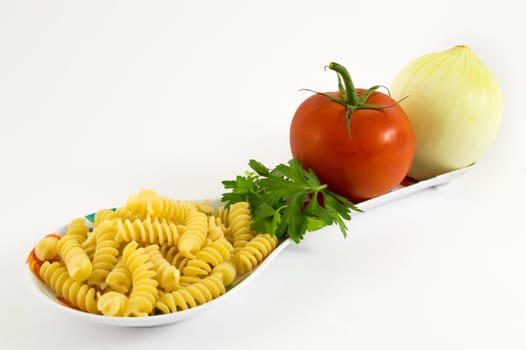 onion, tomato, parsley and pasta on white background