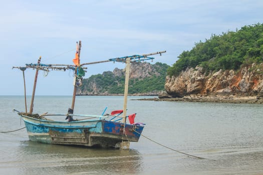 Fishing boat on the beach in summer