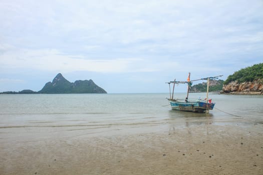 Fishing boat on the beach in summer