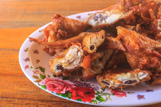 Fresh fried chicken on a plate set, Fresh fried chicken on a wood table
