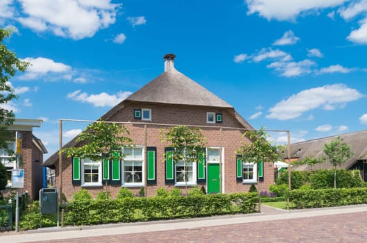typically dutch farmhouse in staphorst. The community of Staphorst is known as one of the most religious in the Netherlands and has a very closed character