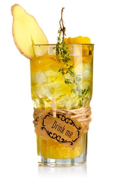 Yellow alcohol cocktail in glass with ginger slice and spices isolated