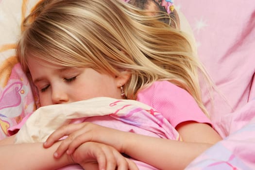 A little girl about to fall asleep, very drowsy