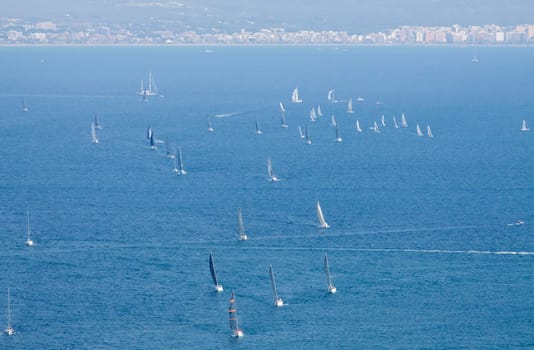 Sailing boat yacht or sailboat group regatta race on sea or ocean water. Panoramic view.