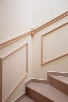 Stylish stairwell with marble steps and stucco decorations